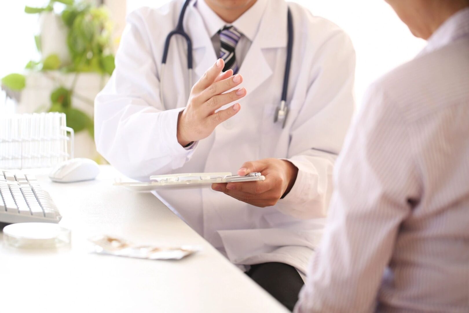 A doctor is talking to someone in the hospital.